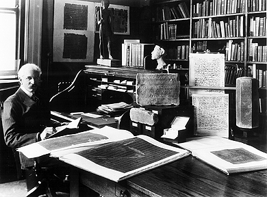 James Henry Breasted in his office at Haskell Hall in 1929 next to plates of the Edwin Smith Surgical Papyrus